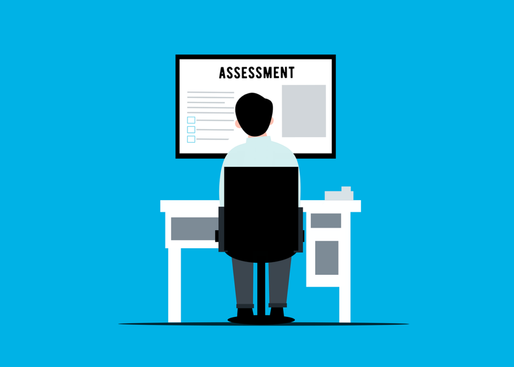 Cartoon image of male student sat at desk before exam